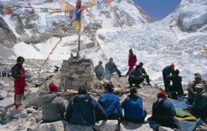 Sherpas holding a puja ceremony at basecamp