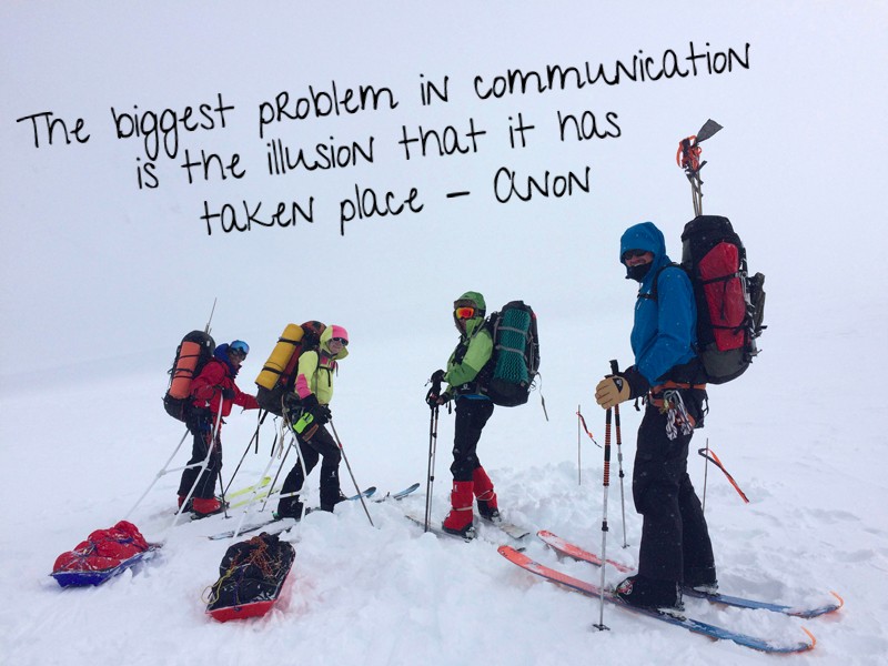 The summit team of four about to head off into the mist. Text: “The biggest problem in communication is the illusion that it has taken place” -Anon